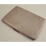 A hallmarked silver cigarette case, of rectangular form with engine turned decoration, weight 5oz