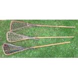 Three lacrosse sticks, stamped T S Hattersley's Viktoria