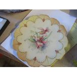 A Royal Worcester plate, decorated with flowers