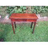 A George III mahogany tea table, with Chippendale taste folding top, having frieze drawer and