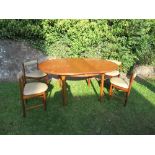A 20th century dining suite, comprising table and four chairs, bearing label Furniture by