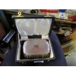 A cased hallmarked silver gentleman's brush and comb