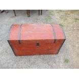 A domed top trunk, with metal bands, 38ins x 18.5ins x height 24ins