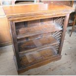 A modern bookcase, with pierced sides, width 32ins, depth 14ins, height 36ins