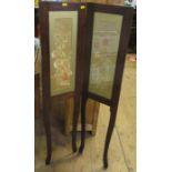 An Edwardian oak framed two fold screen, with floral panels, height 45ins, width 21ins
