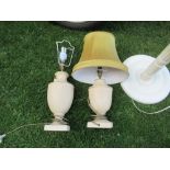 A painted standard lamp with shade, together with a pair of table lamps with shades