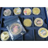 A collection of Royal Commemorative coins, not gold and albums not complete