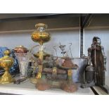 A collection of metalware, to include oil lamps, scales, fire tools, spirit kettle etc