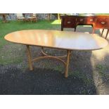 A 20th century Ercol dining room suite, comprising a Golden Oak Windsor oval extending dining table,