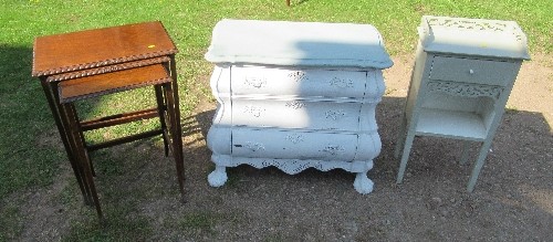 A small painted chest of drawers, width 30ins, height 36ins, together with a painted side table