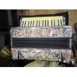 A cased Rauner Virtuoso accordion