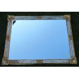 A large gilt mirror, overall dimension, 46.5ins x 35ins