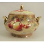 An orb porcelain circular tureen and cover, decorated with fruit to a mossy background by F Higgins,