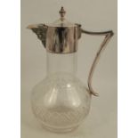 A silver plated and glass claret jug, with mask to the spout