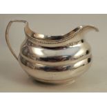An Irish silver jug, with gadrooned edge, engraved with a crest, Dublin 1808, weight 5ozCondition