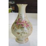 A Royal Worcester vase, decorated with flowers, shape number H285B, height 4.25ins