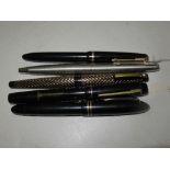 Three Parker fountain pens, a Sheaffer fountain pen, and one other