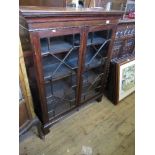 A Georgian style mahogany glazed display cabinet, raised on bracket feet, width 42ins