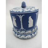 A blue Jasperware Stilton cover and stand, decorated all around with classical figures and foliate