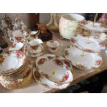 A Royal Albert Old Country Rose tea service and three tier cake stand