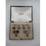 An Austin Reed encased stud set, with rectangular studs inset with mother of pearl panels