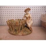 A Royal Worcester shot enamel and gilt figure, a girl seated beside a basket, signed Hadley, 8ins