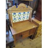 An Edwardian tile back wash stand, fitted with a cupboard below, width 32.5ins , depth 18ins x