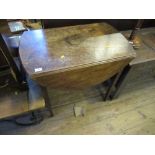 A late Georgian mahogany oval pembroke table, width 32ins