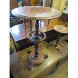 A 19th century mahogany circular table, with galleried wool bowl below, raised on three slender