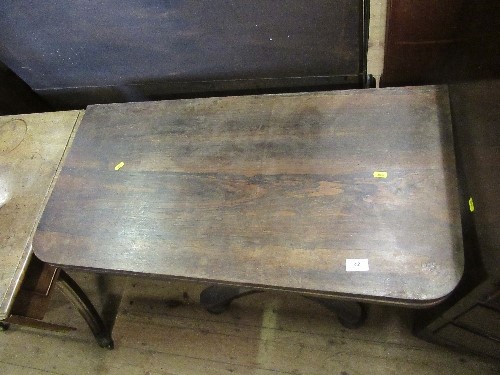 A 19th century rosewood fold over table, raised on a column terminating in a platform base, width - Image 2 of 2