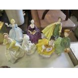 A collection of figures, to include three Royal Doulton, two Worcester and an unmarked Worcester