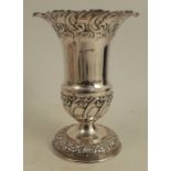 A silver vase, with flared rim and embossed decoration of scrolls and leaves, Sheffield 1951, weight