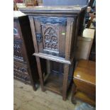 An Gothic style oak cabinet on stand