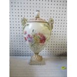 A Royal Worcester style covered vase, unmarked, painted with summer flowers, height 12ins