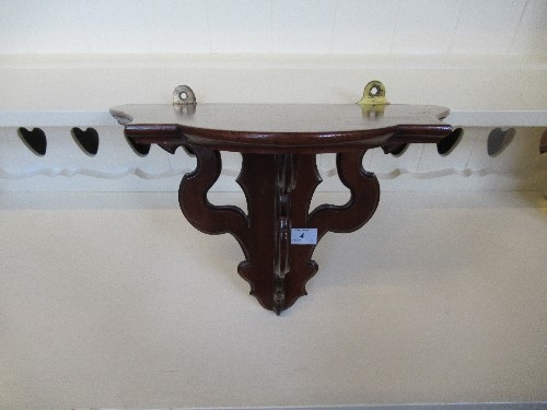 A mahogany wall bracket, with pierced supports, width 14ins