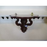 A mahogany wall bracket, with pierced supports, width 14ins