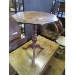 An octagonal topped 19th century table, raised on a tripod base, width 19ins