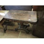 A 19th century rosewood fold over table, raised on a column terminating in a platform base, width