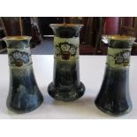 A Royal Doulton garniture of vases, decorated in blue/green mottled ground, heights 10ins, 9.5ins