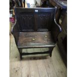 An Antique oak gothic chair