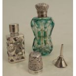 A Victorian overlaid glass scent bottle, of shaped rectangular form, the hinged silver lid with