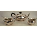 A silver three piece tea set, with shaped edge, Sheffield 1904, weight 19oz