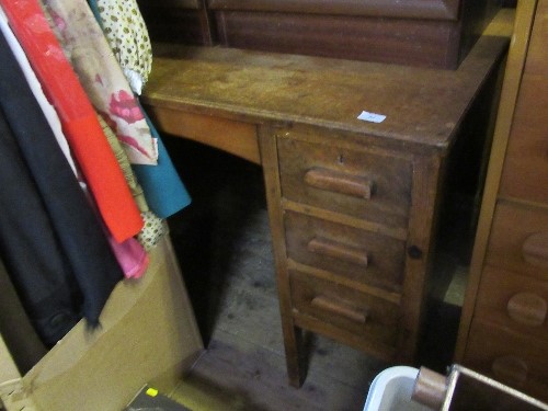 An oak knee hole desk, fitted with a central drawer flanked by three drawers to each side, 42ins x
