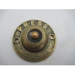 A circular brass bell push, diameter 3.75ins