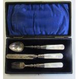 A cased silver christening set, the knife, fork and spoon with mother of pearl handles and