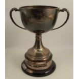 A silver trophy, engraved The Olive Meacham Cup, having loaded base, Chester 1929, raised on an