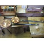 Two copper warming pans