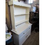 A painted cupboard dresser, with close boarded rack over, having two drawers and cupboards below,