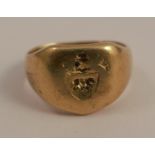 An 18 carat gold crested signet ring, finger size Q, 10.5g gross