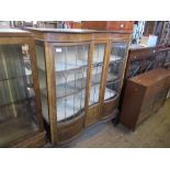 An Edwardian Art Nouveau style double break front display cabinet, with leaded light panels, width